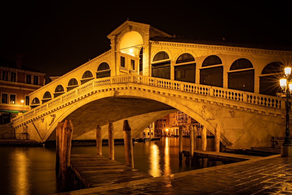 yellow concrete bridge in between buildings