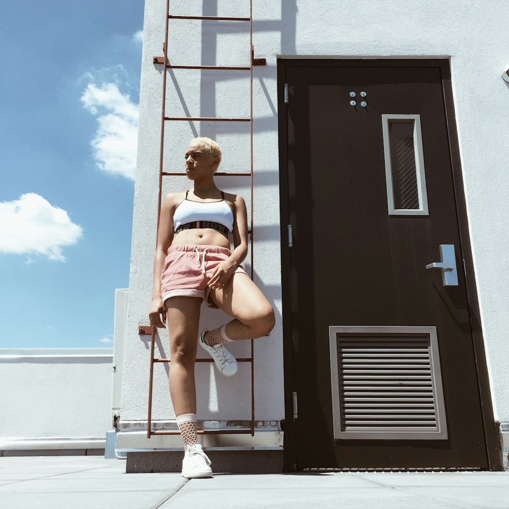 woman standing near door