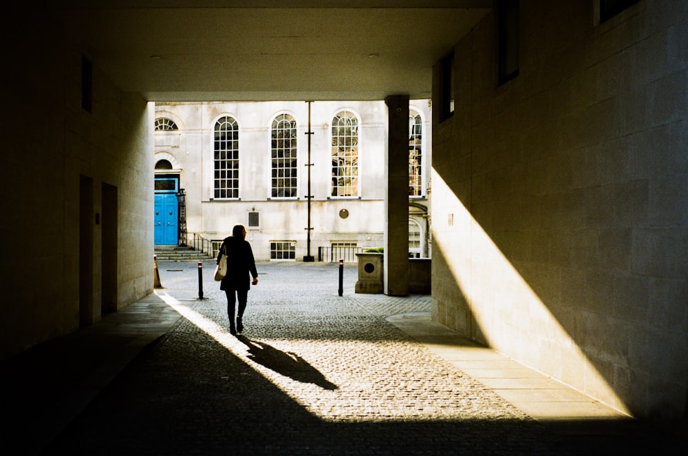 person walking near building during daytime