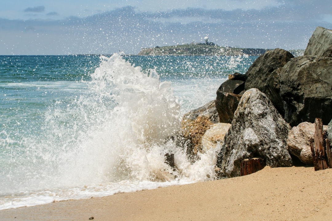 water crashing on rocky shore