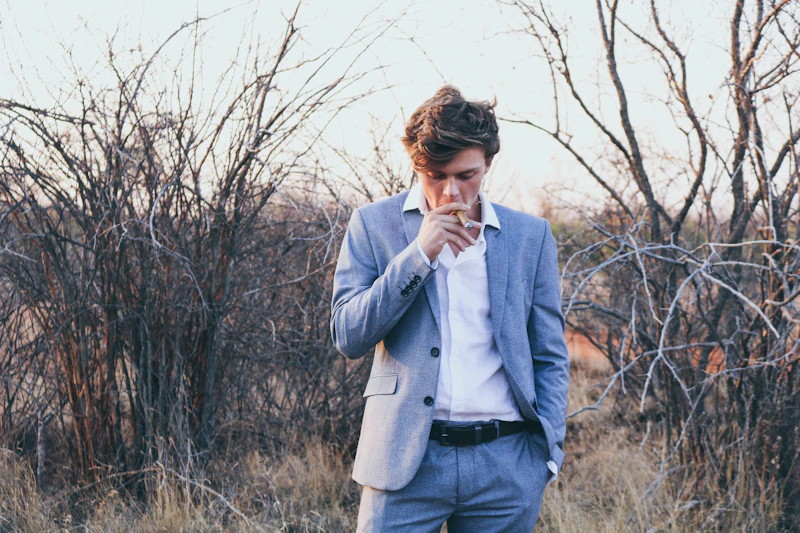 UK sugar daddy holding a cigarette, enjoying a moment