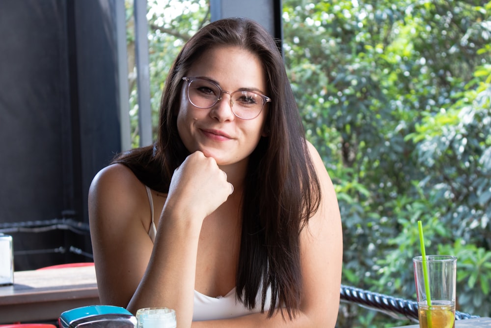 portrait of woman wearing white tank top