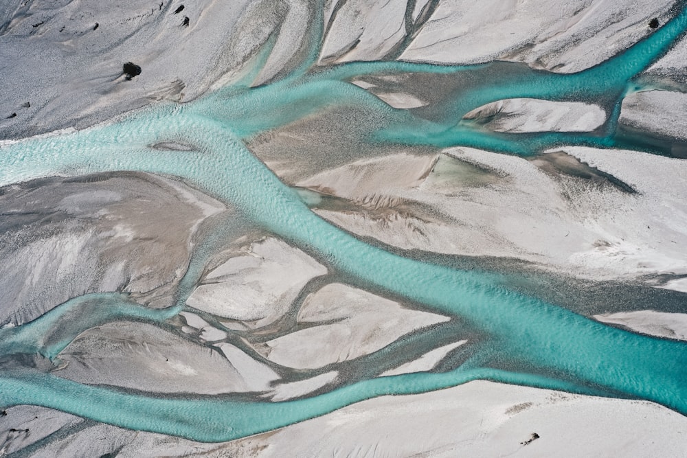 an aerial view of a river flowing through a valley