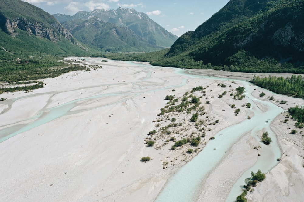 body of water near mountains