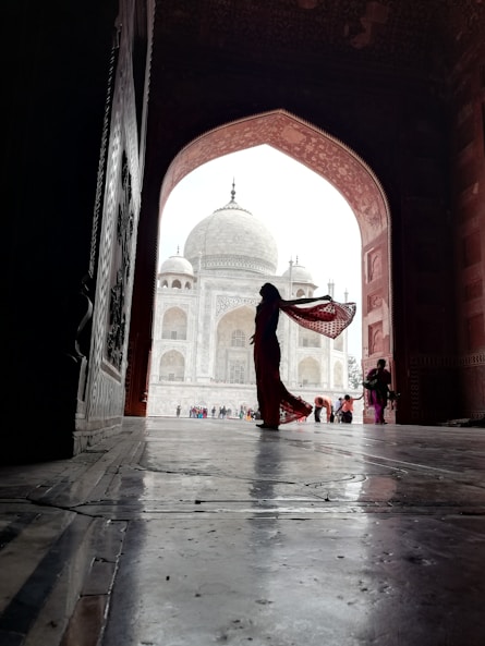 Indian woman at TajMahal in Sari Making it best Traditional Apparel Brand in India