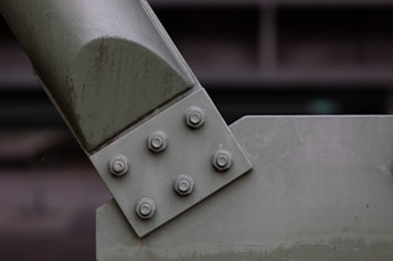 a close up of a metal object with rivets