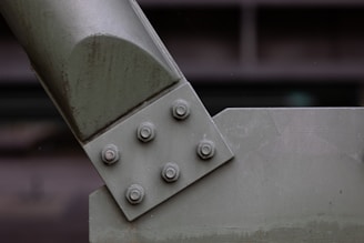 a close up of a metal object with rivets