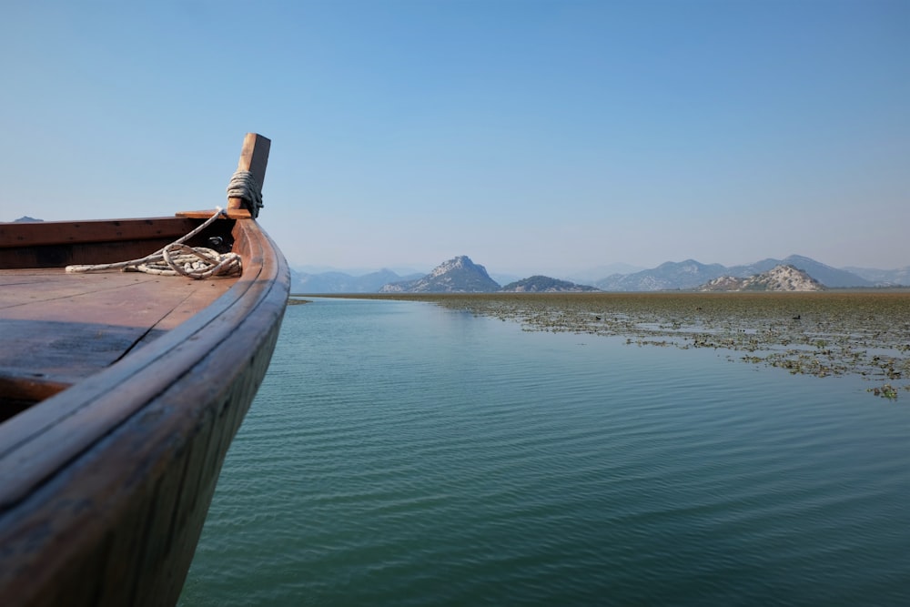 brown wooden boat daytime