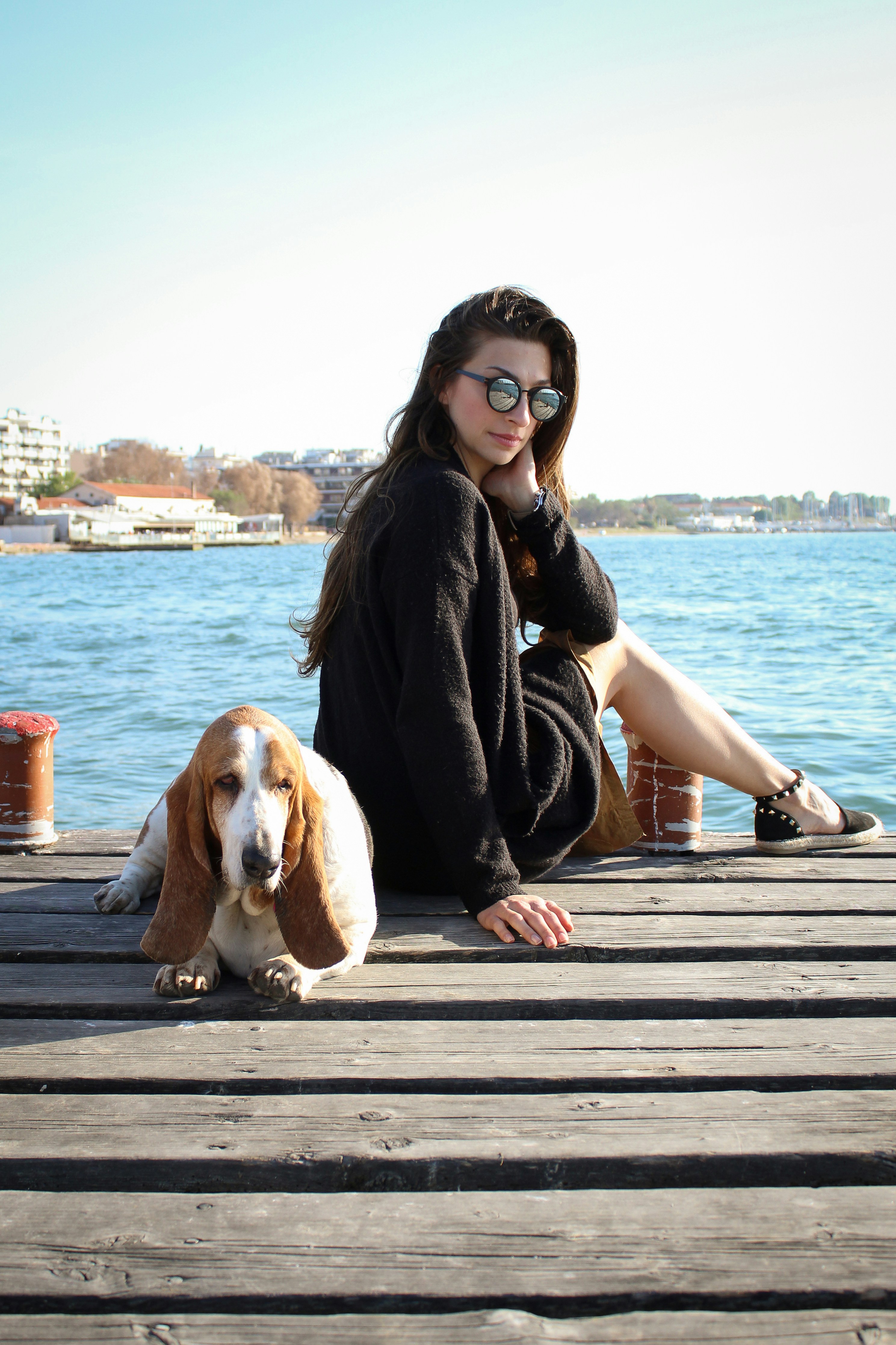 Female model realing with the her dog