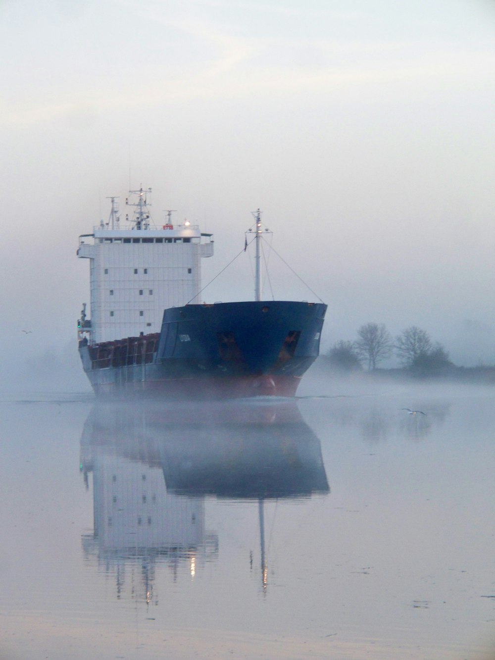 white and black boat in body of water during daytime