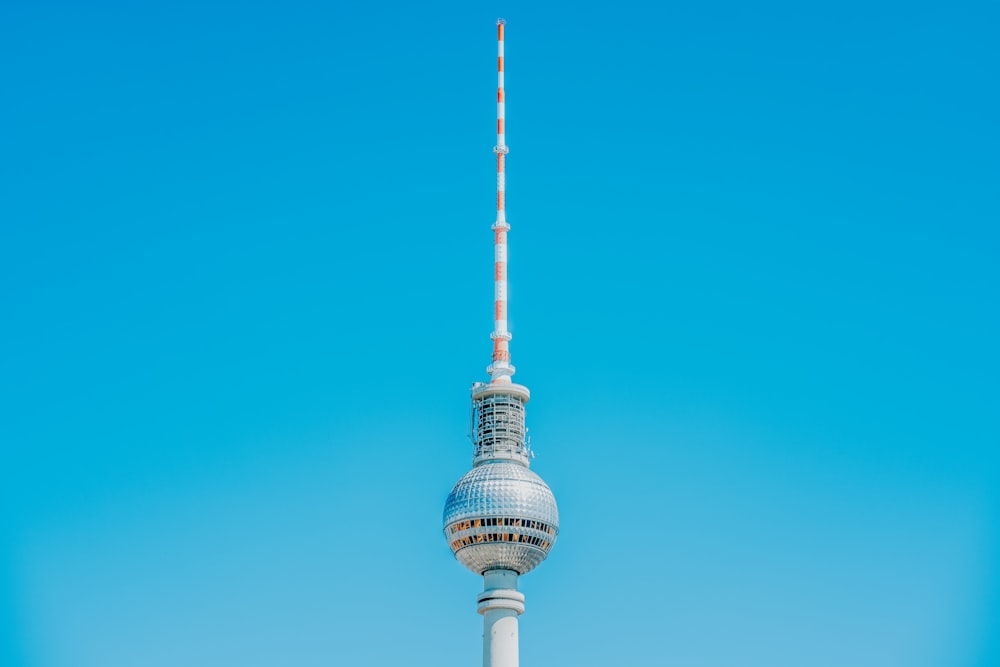 a tall white tower with a sky background