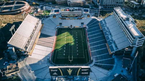 Aerial view of the stadium before renovation, showing old stands and empty field