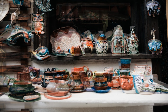 A vibrant display of various handmade clay items.