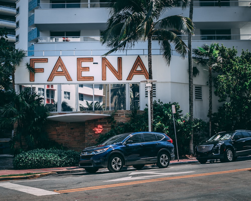 two vehicle parked near the building during daytime