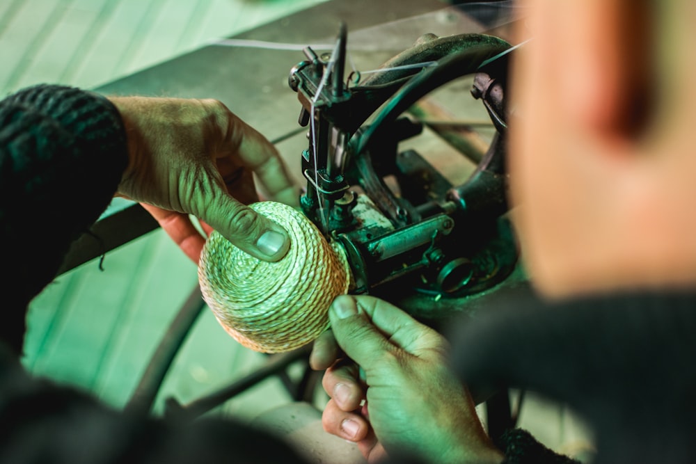 a close up of a person working on a bicycle