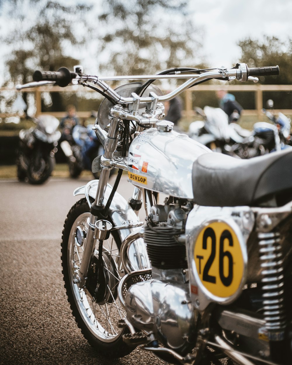 a close up of a motorcycle parked in a parking lot