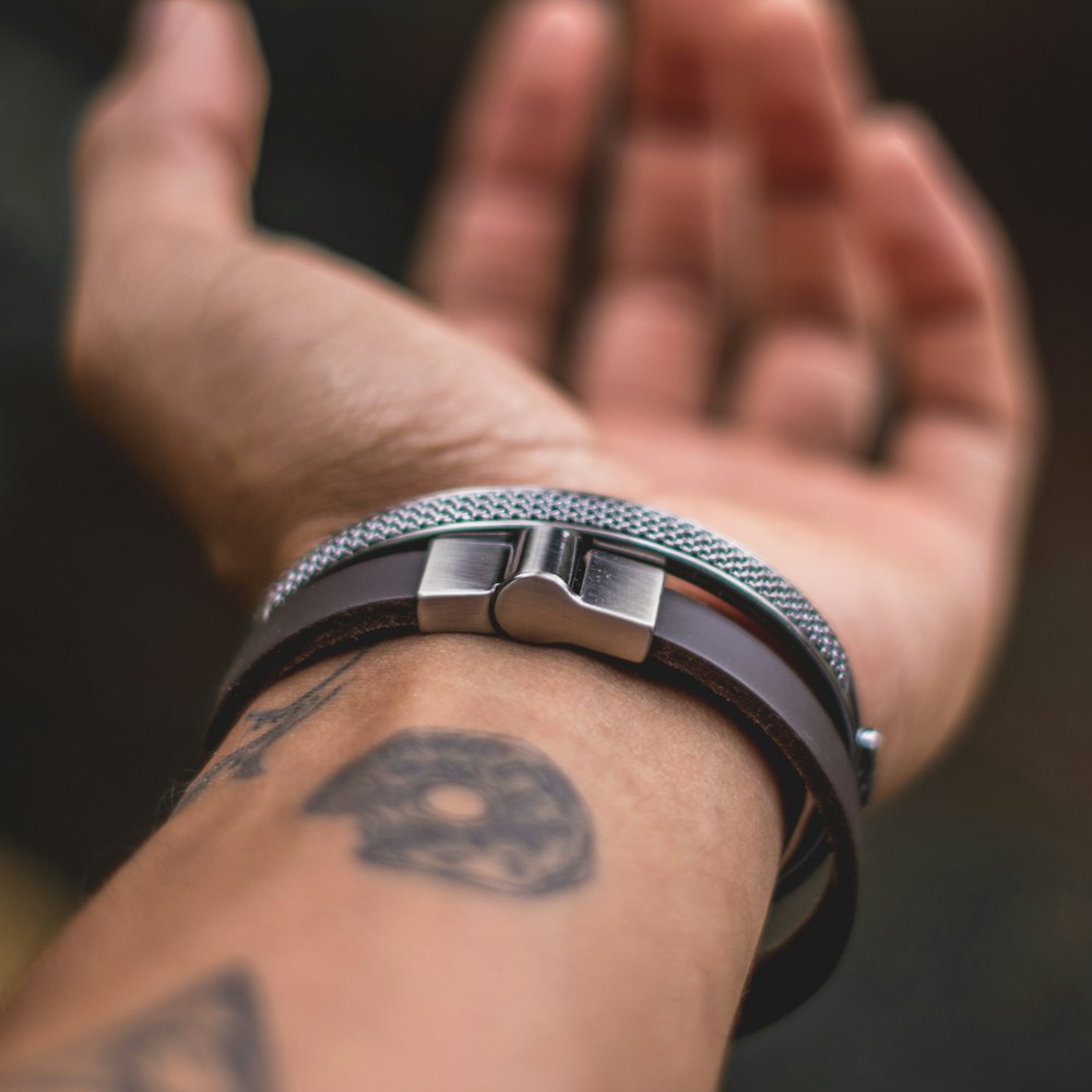 shallow focus photography of silver-colored bracelet