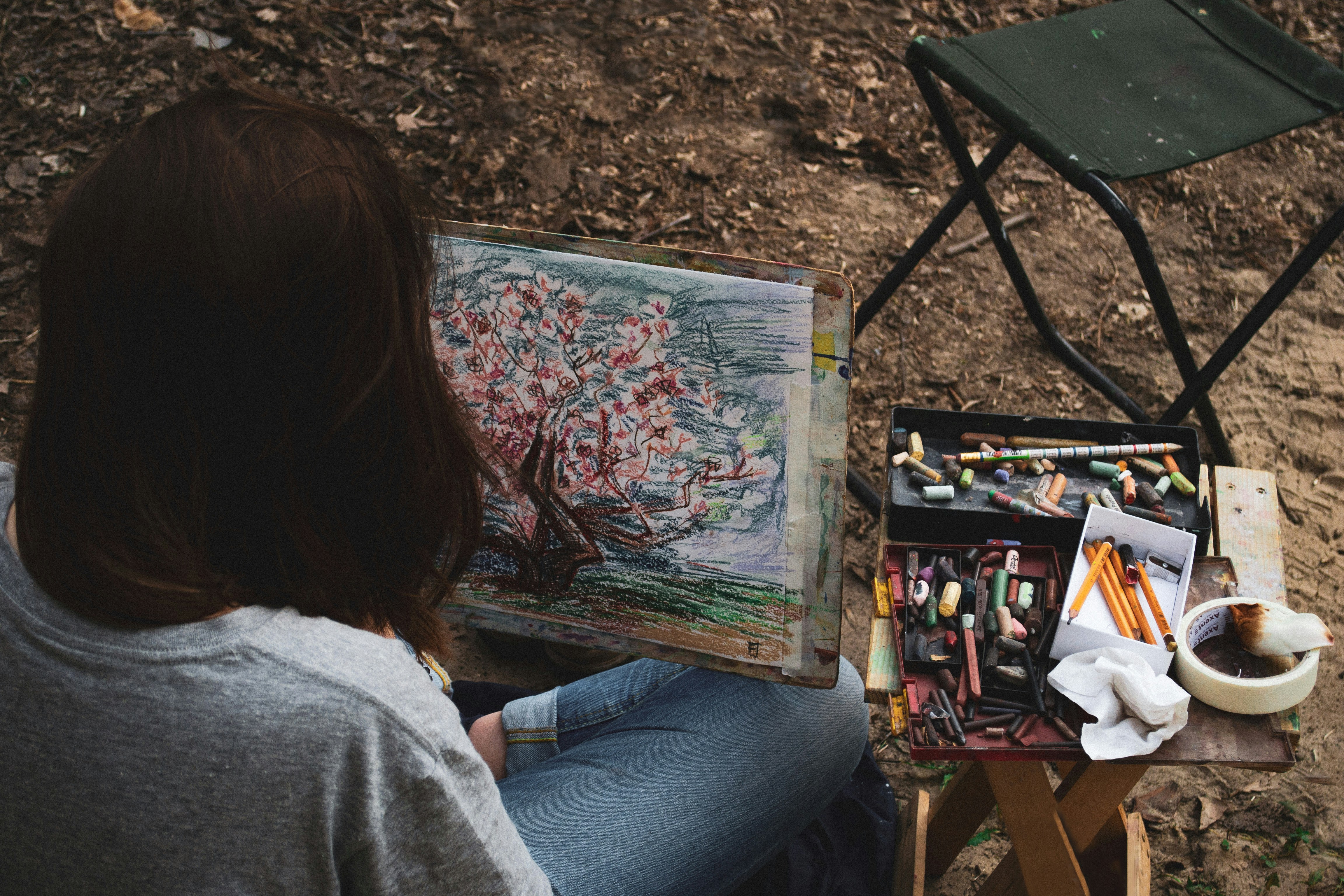 A person enjoying a hobby like painting or gardening, symbolizing self-care and emotional well-being