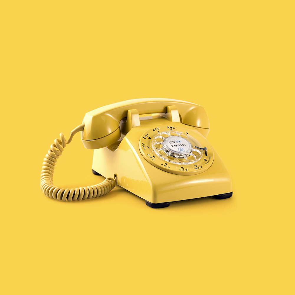 yellow rotary telephone