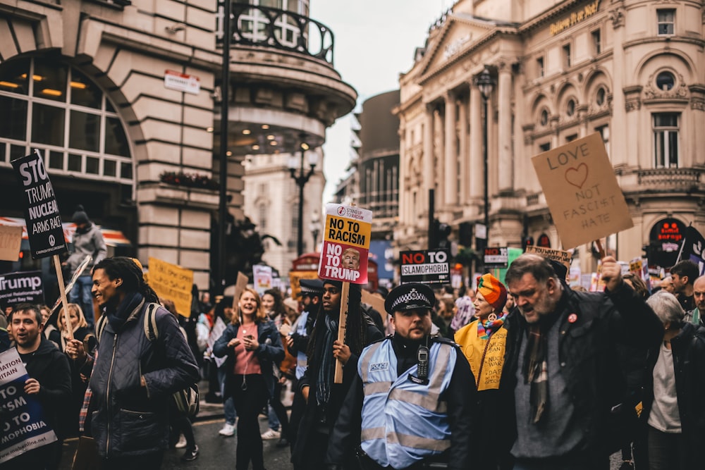 crowd rallying outside buildings