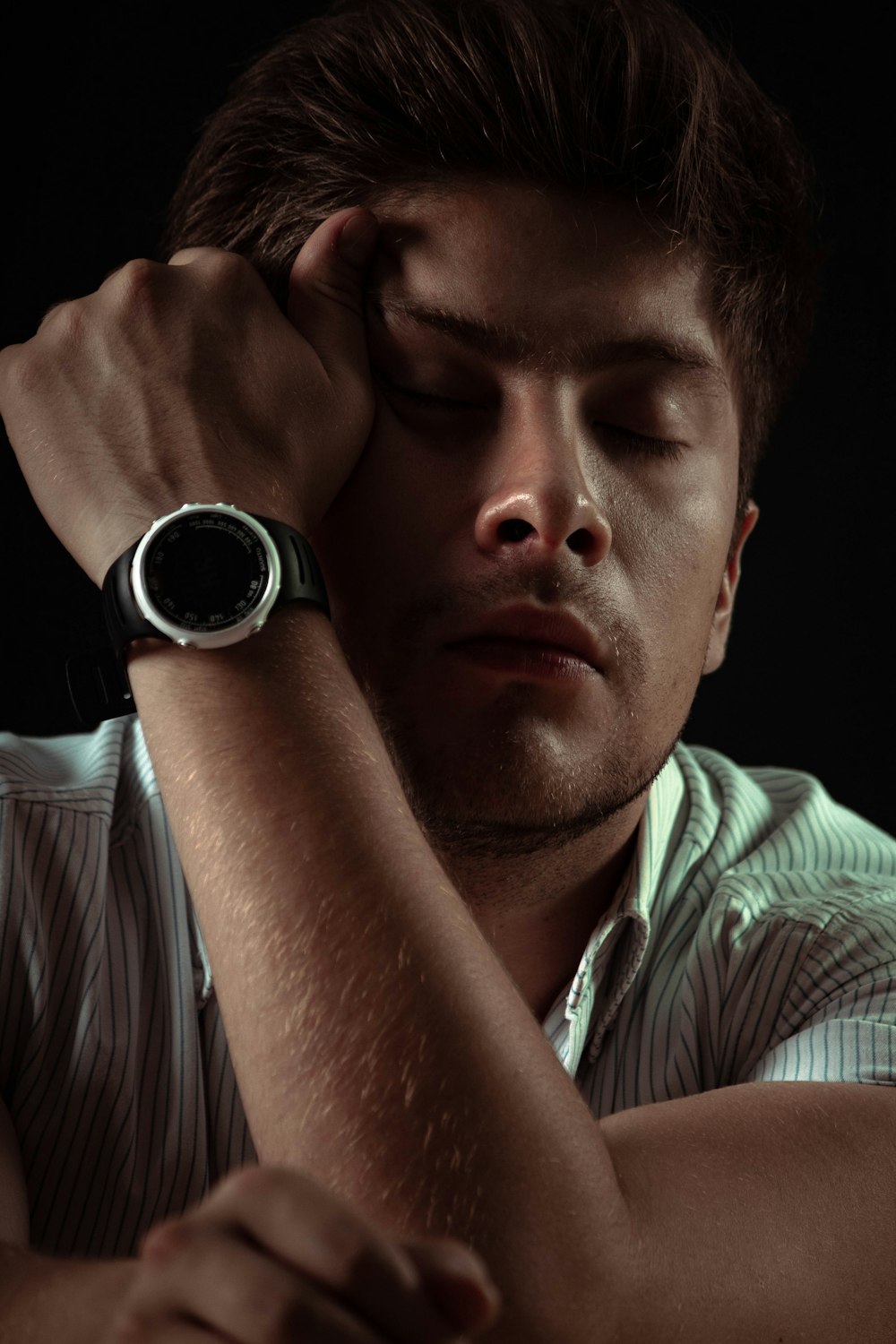 man wearing black smartwatch