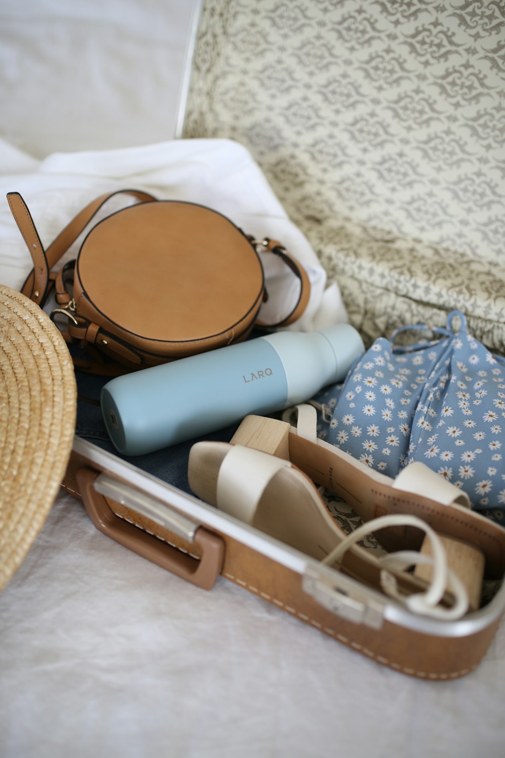 brown and gray leather suitcase