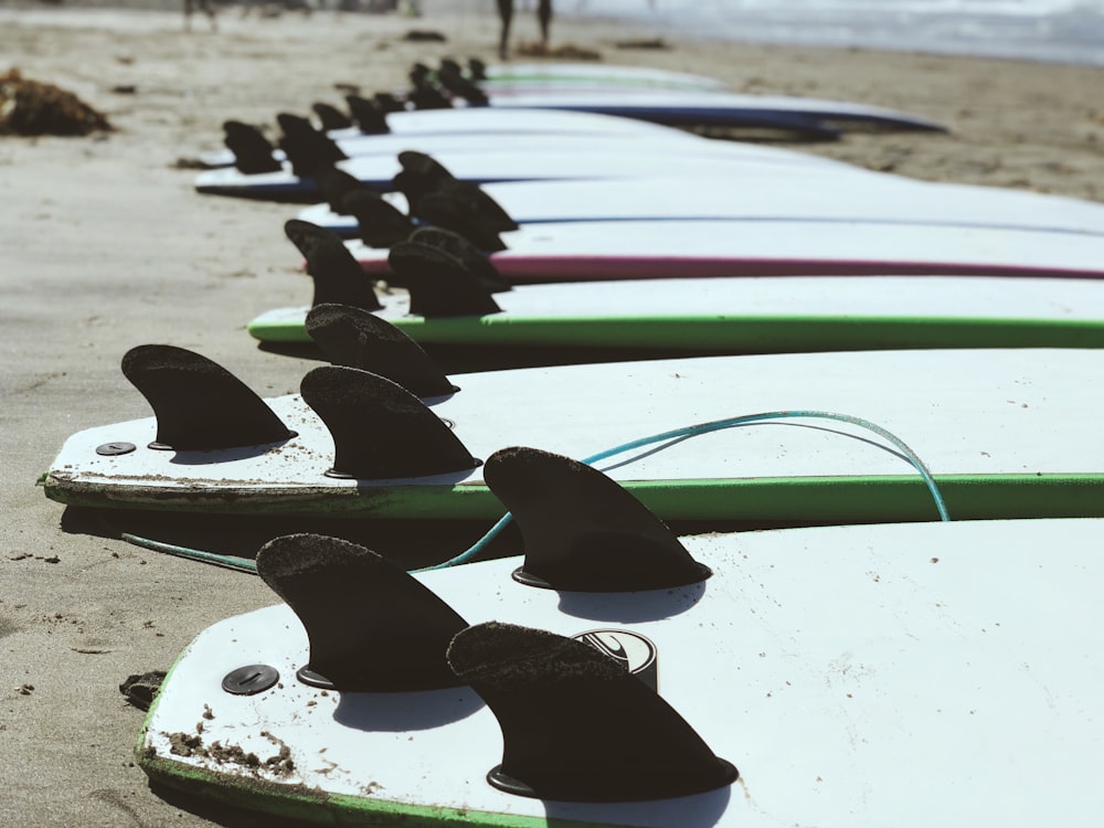 green surfboard lot near seashore