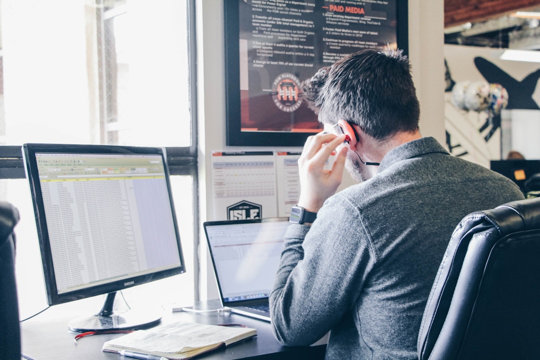 A man at a desk, engaged in exploring AI orchestration's significance in technology.