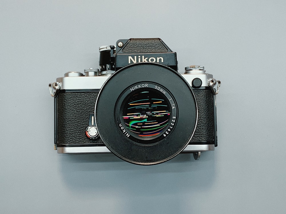 black and grey Nikon DSLR camera