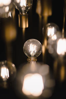 Rows of LED bulbs glowing softly on display shelves in a showroom.