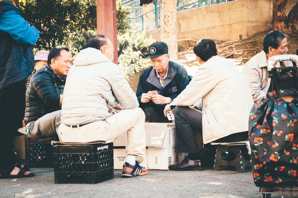 four man sitting on the chair