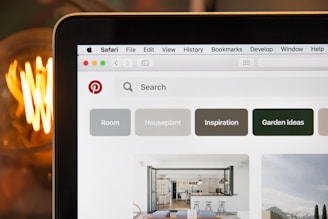 A friendly coach on a video call guiding a creator through Pinterest strategies.