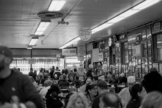 A bustling restaurant interior filled with happy diners.
