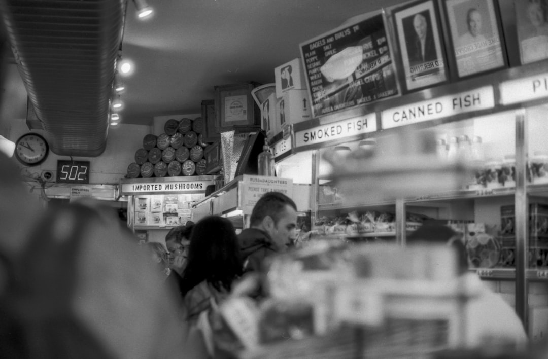 grayscale photograph of people inside store