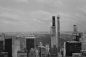 Grayscale image of a city skyline at dusk, symbolizing growth and opportunity.