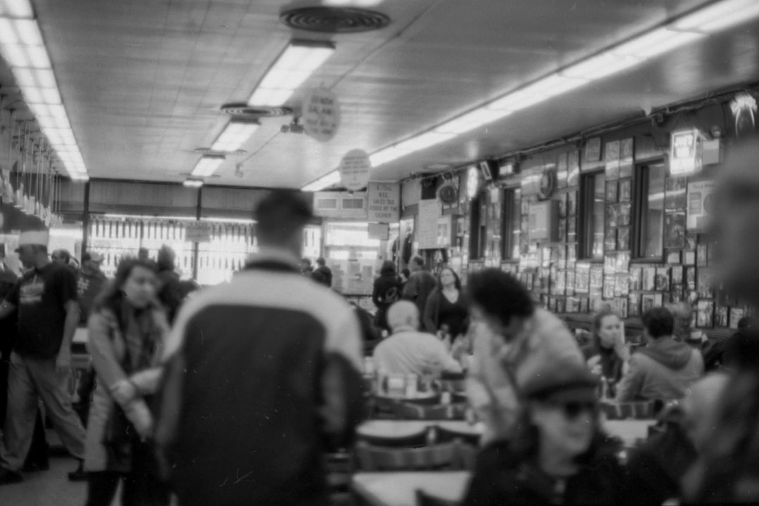 grayscale photography of people in restaurant