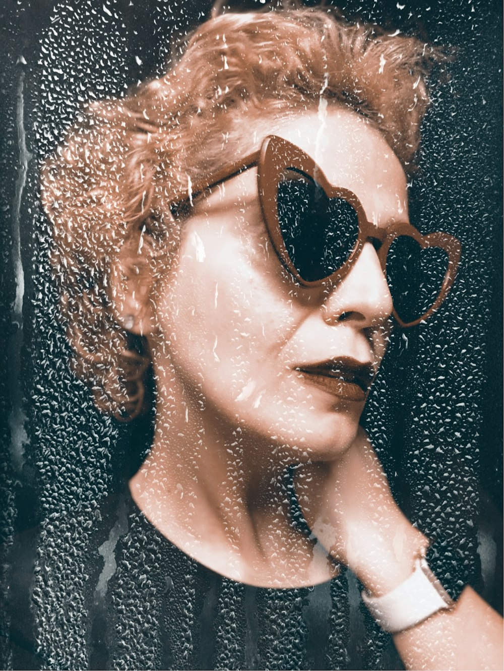 woman wearing brown frame sunglasses inside well lit room