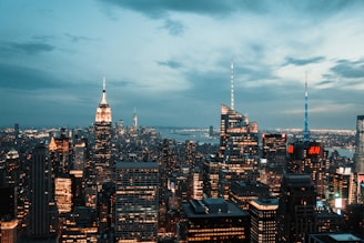 aerial photography of concrete high rise building under cloudy sky