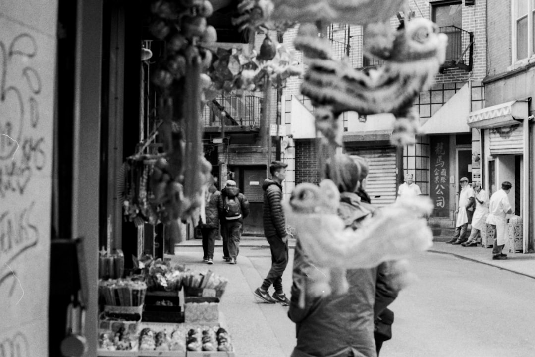 grayscale photography of poeple people walking on street