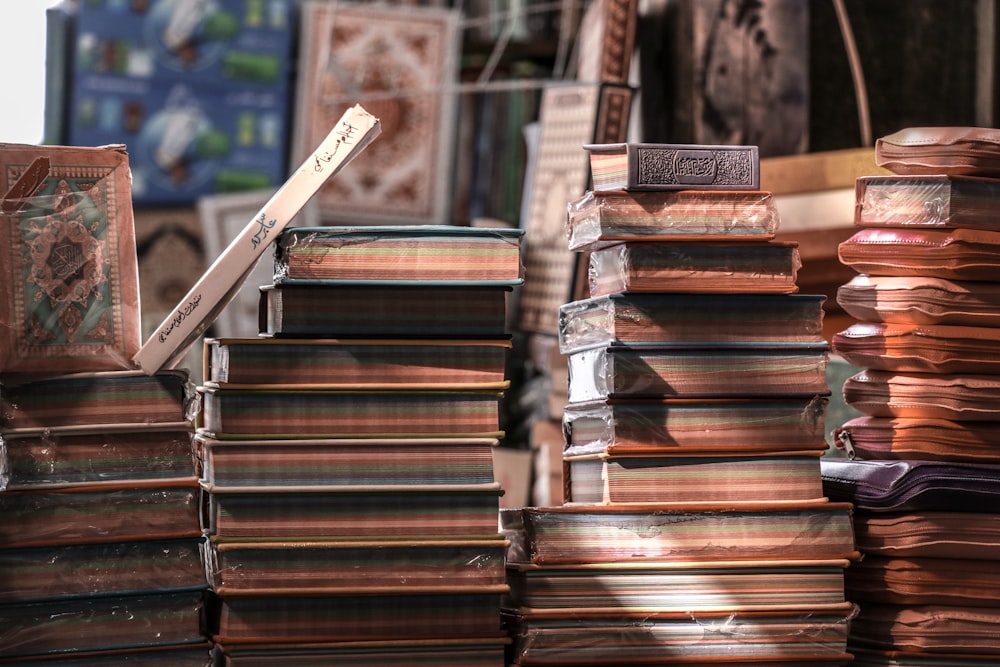 selective focus photography of pile of books