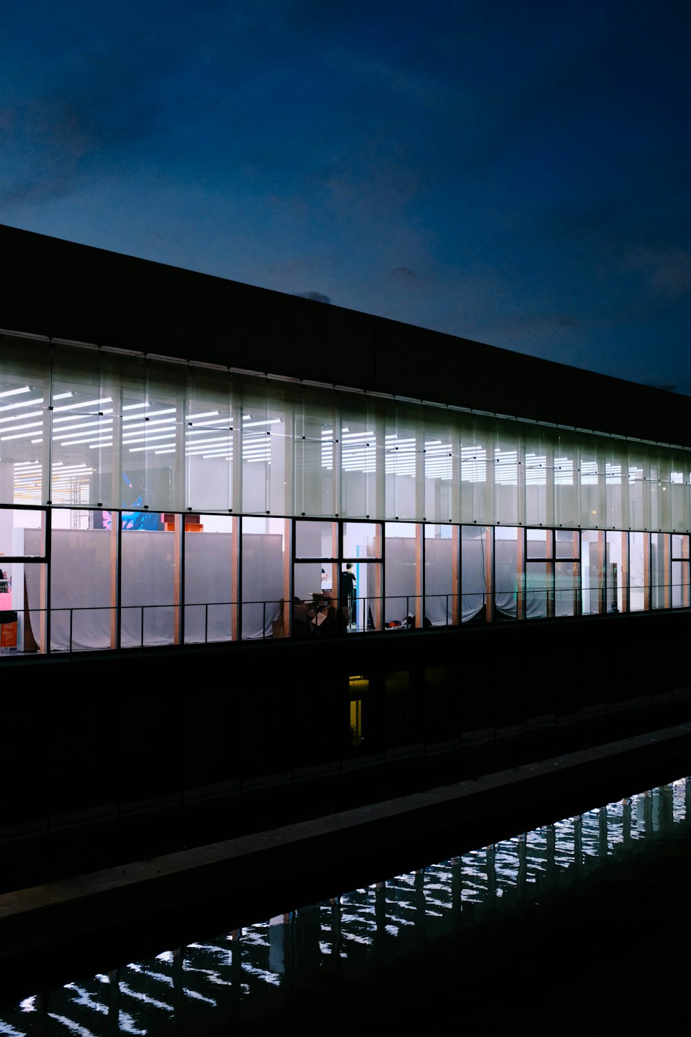 lights turned on in black concrete building