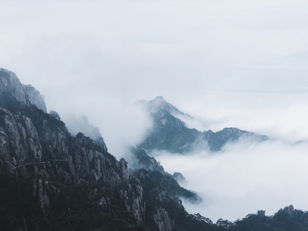 mountains under cloudy sky during daytime