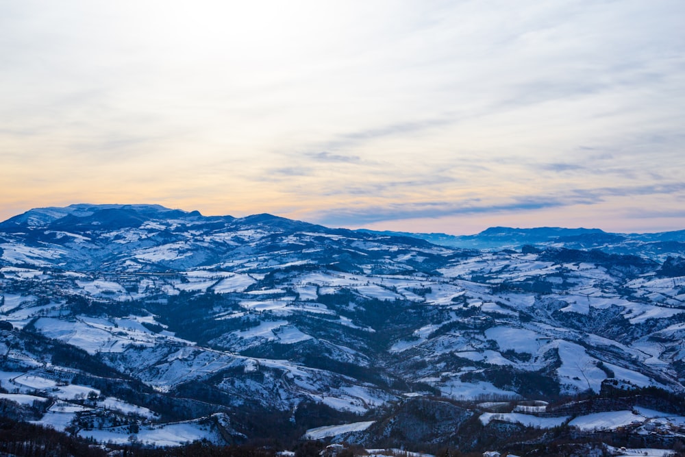 a view of a mountain range covered in snow