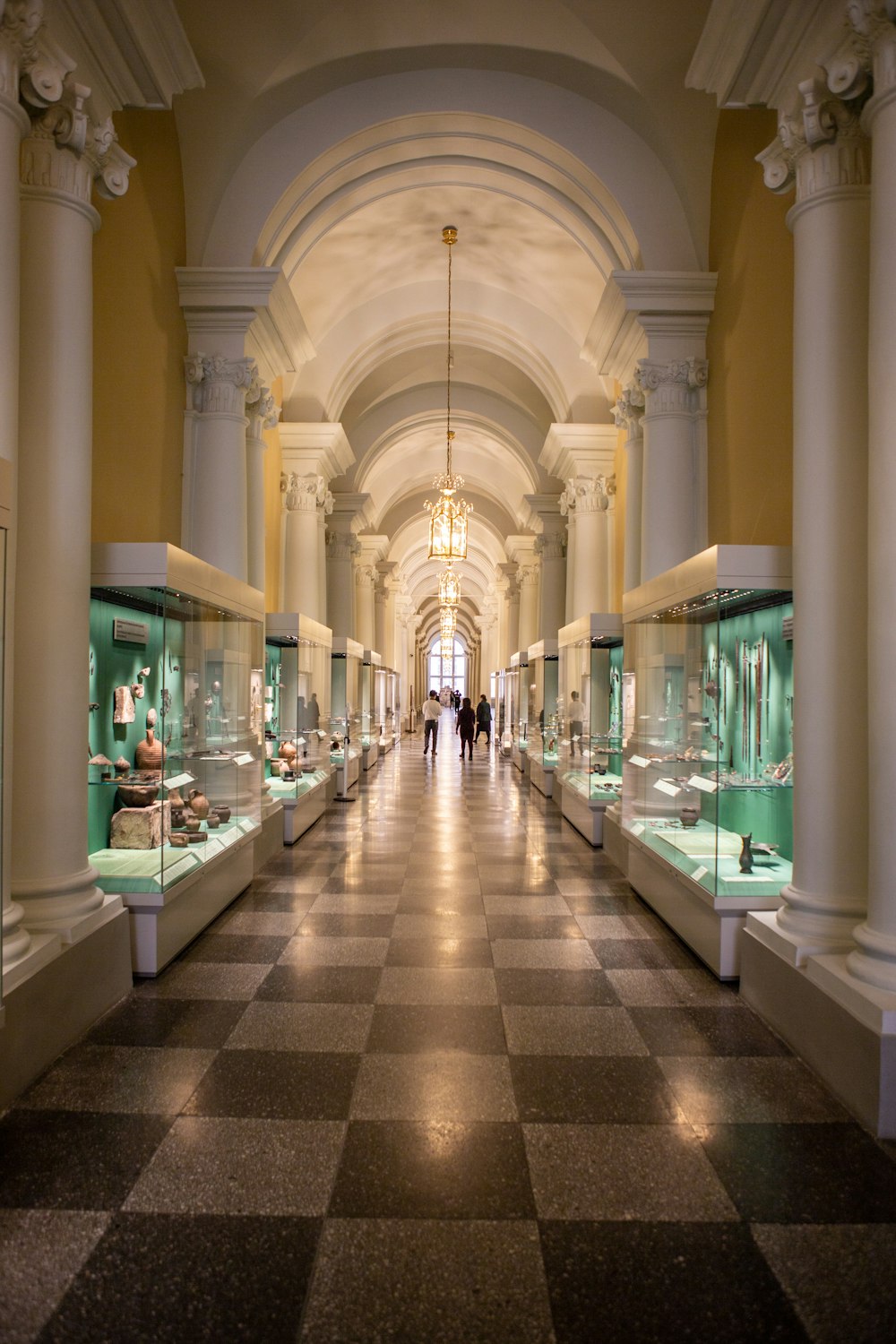 people walking on hallway inside building