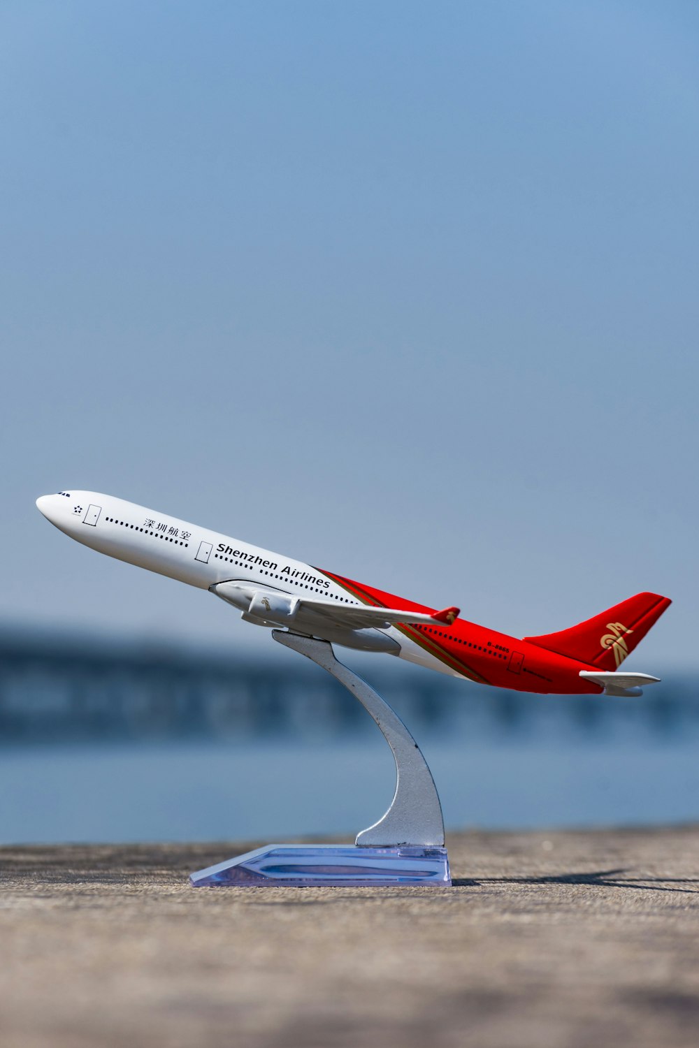 red and white airliner miniature display