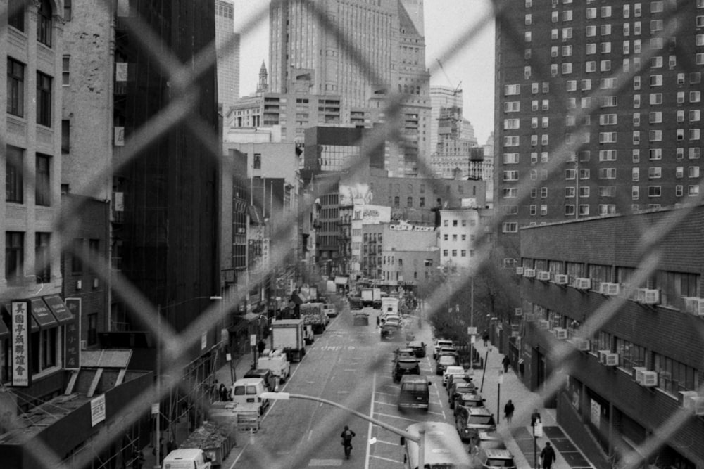 gray scale photography of vehicles on street