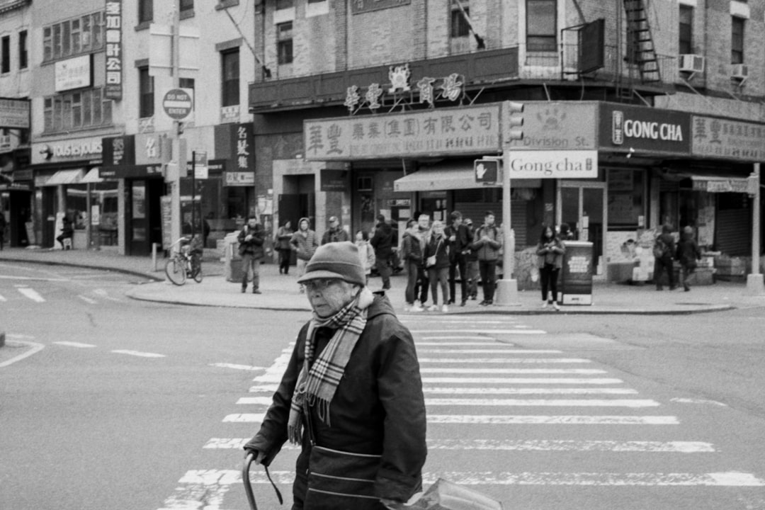 grayscale photography of people in Gong cha street