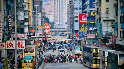 A vibrant street scene from an international city bustling with tourists.
