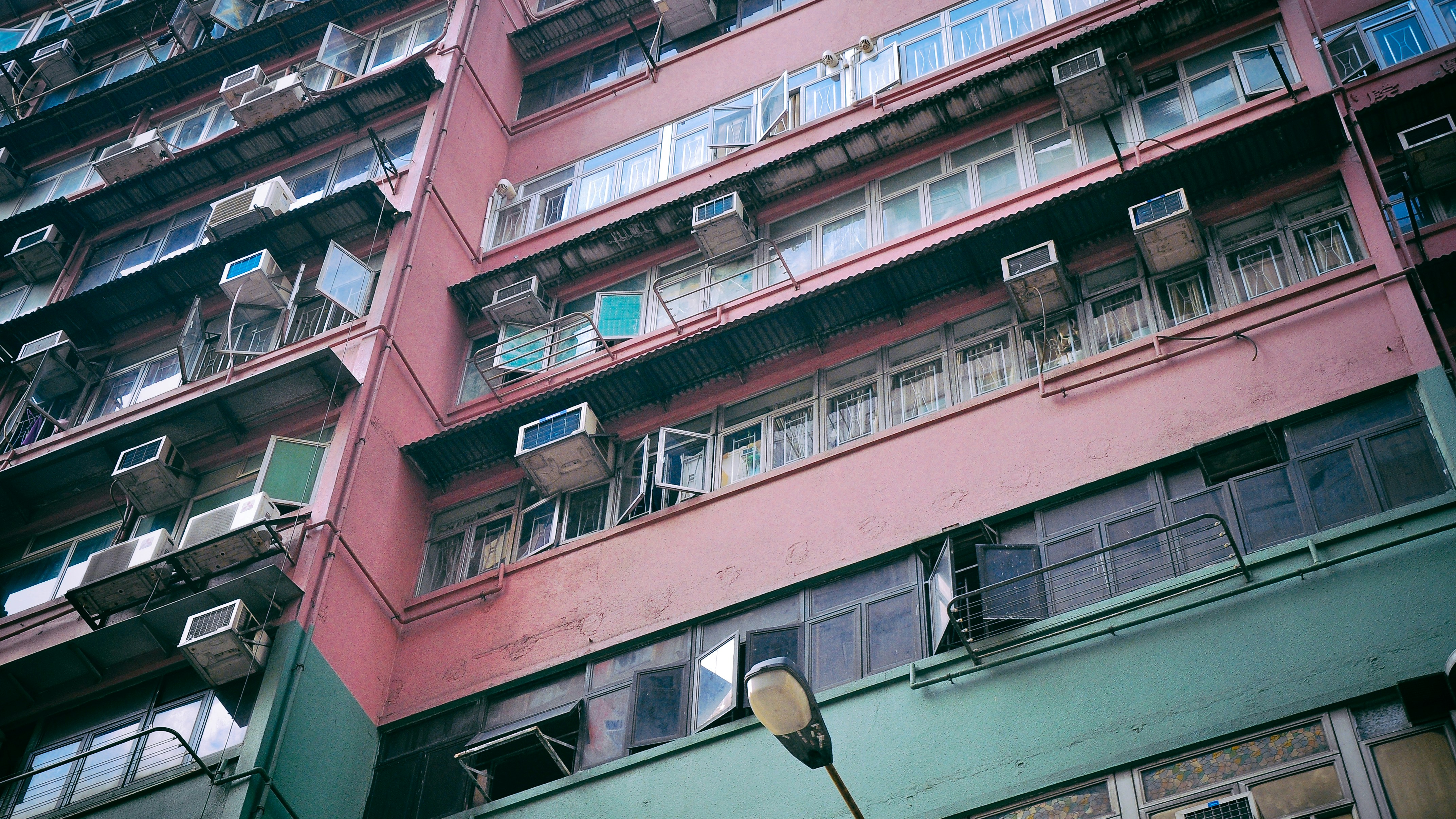 pink and green painted building