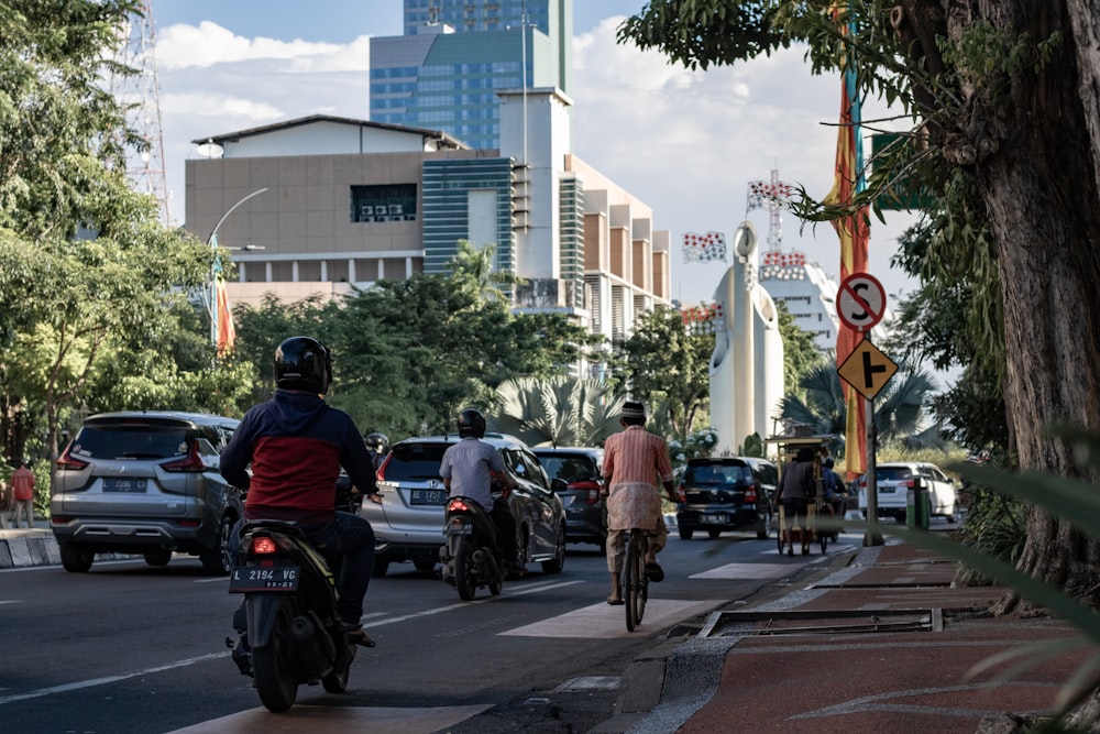 man riding motor scooter